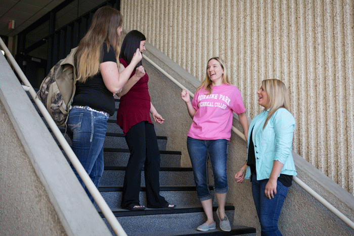 Four females standing on Moraine Park staircase