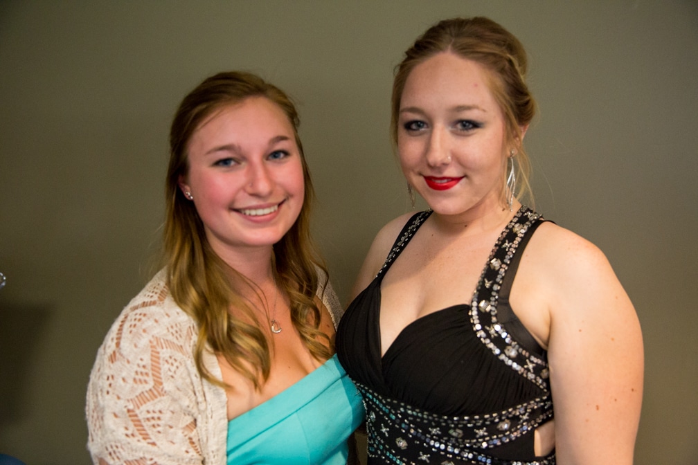 Two females all dressed up for the Moraine Park Technical College Cosmetology Fashion Show