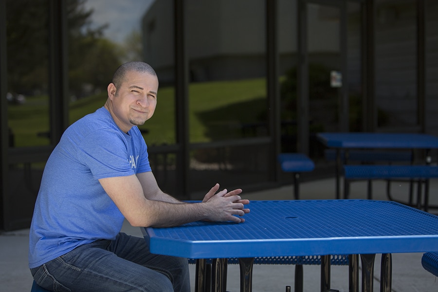Male Moraine Park student sitting at picnic table