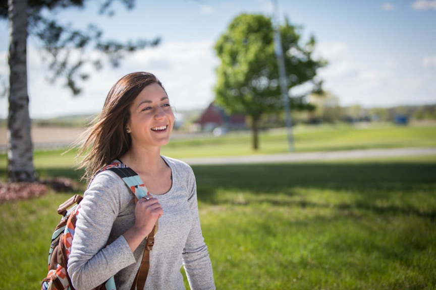 Female Moraine Park student outside with backpack