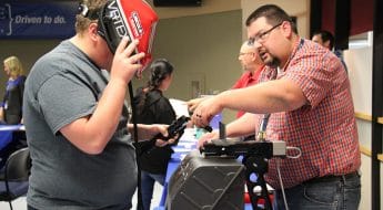 Attendee uses the virtual welder at the MPTC Career Showcase
