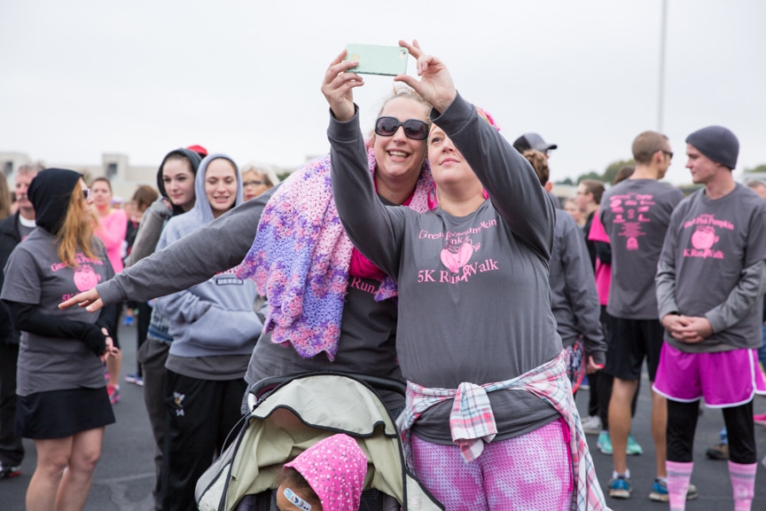 two women take selfie at moraine park pink pumpkin walk