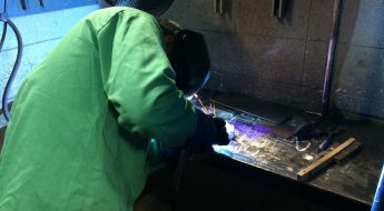 Welding student welding in the lab
