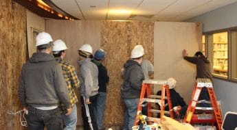 Moraine Park Construction students assembling a wall