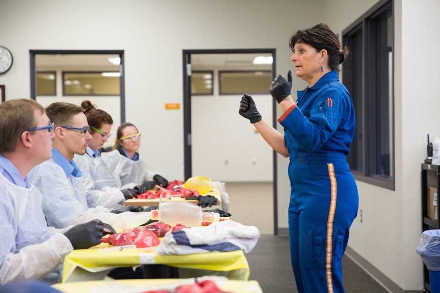 female paramedic speaks to class of EMT students