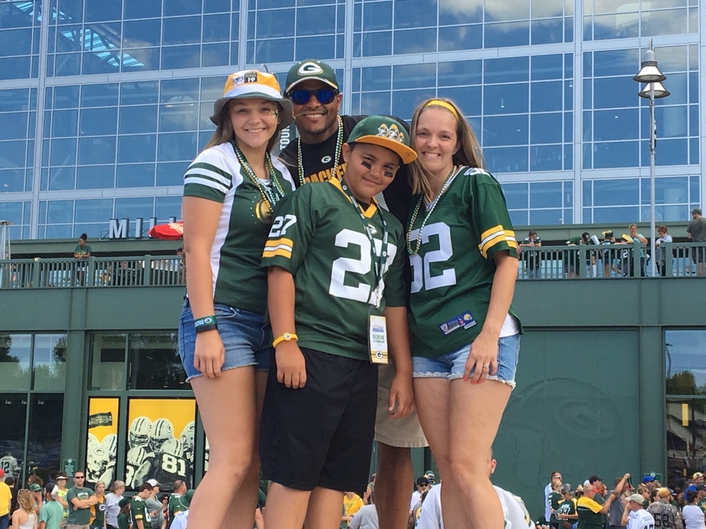 Family picture outside of Packer stadium