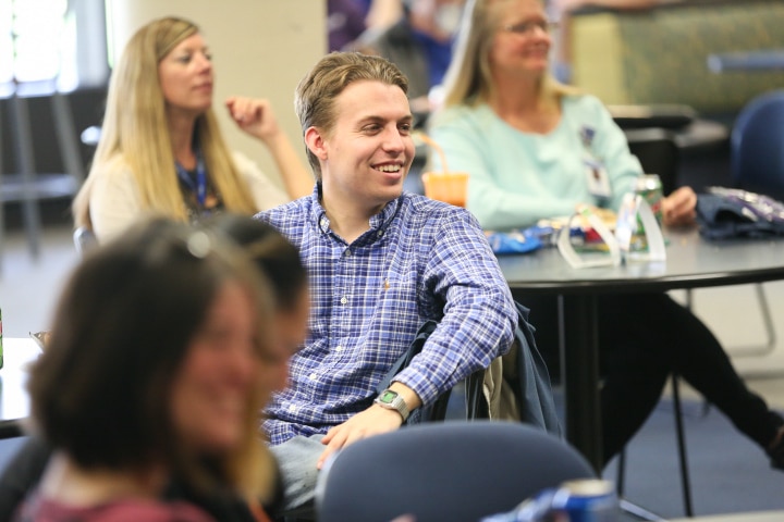 male student laughs during John Cassidy show at Moraine Park