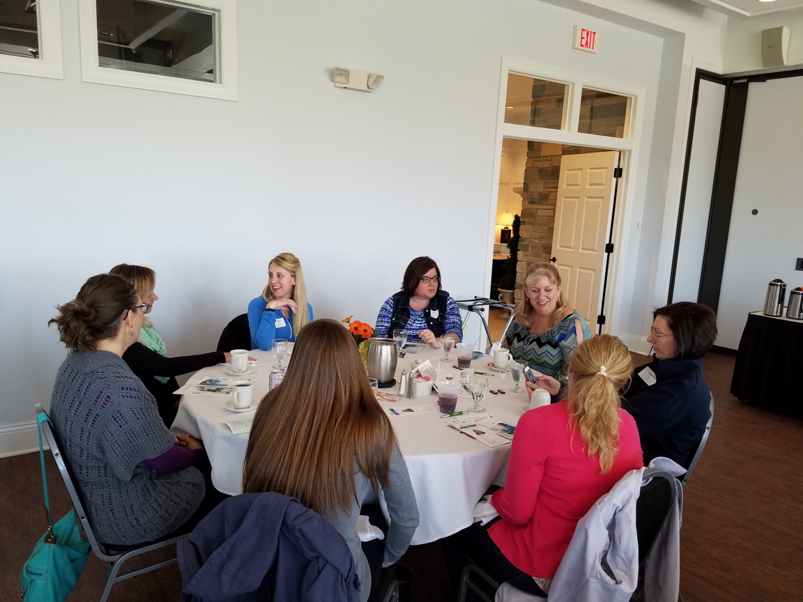 mptc Wisconsin Women in Higher Education Leadership workshop attendees sit around table
