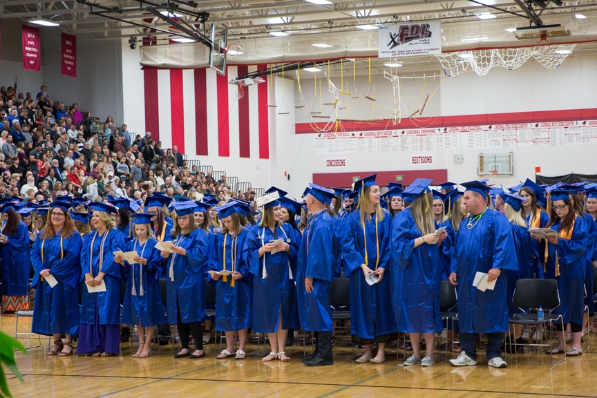 Graduates stand in large group at Moraine Park commencement ceremony