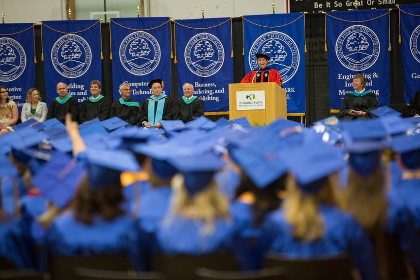 Morna Foy speaks from podium at Moraine Park commencement ceremony