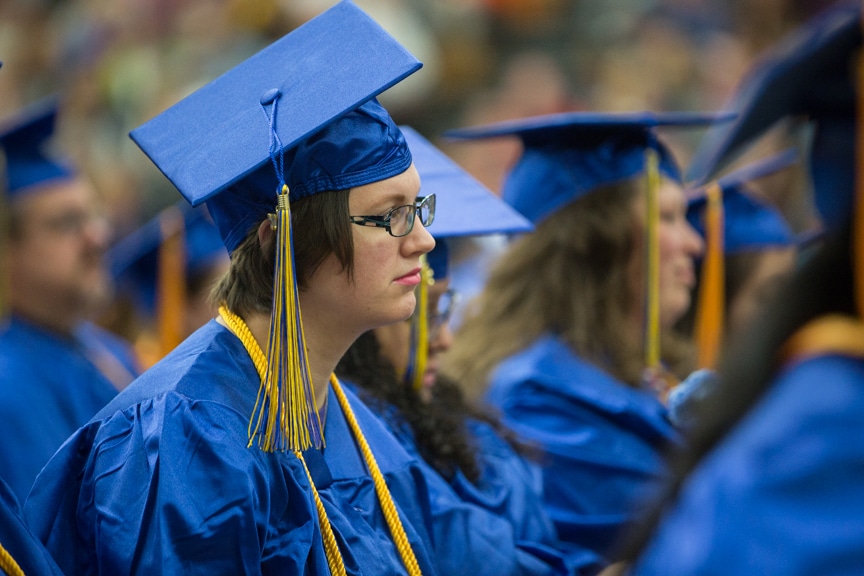 Female graduate listens stoically at Moraine Park commencement ceremony