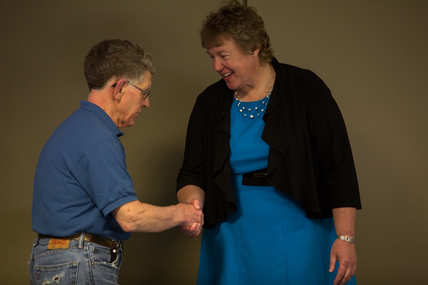 Bonnie Baerwald shaking hands with retiree at Moraine Park Retirement Service Recognition event