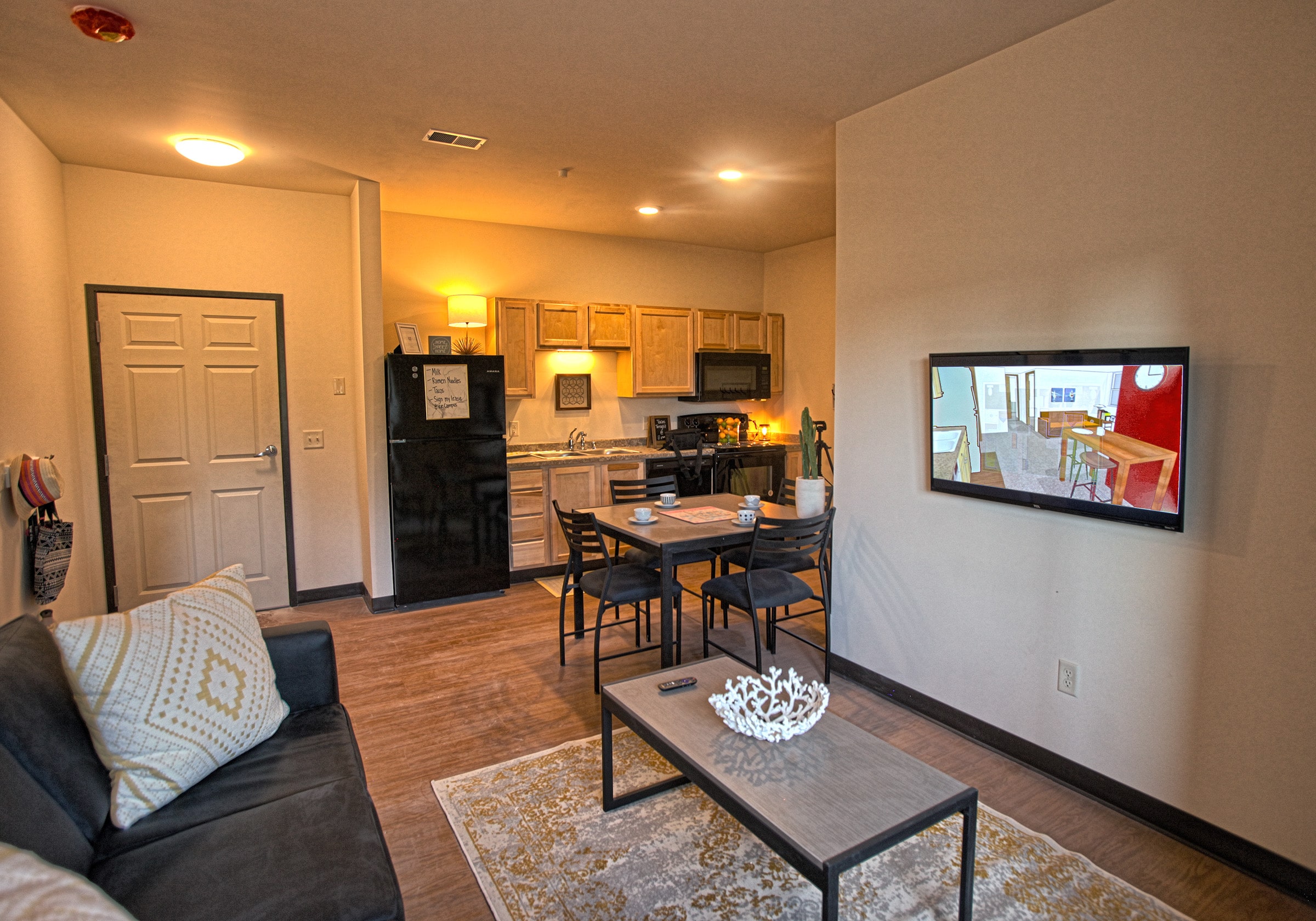 Inside view of Vue campus room with kitchen and living room