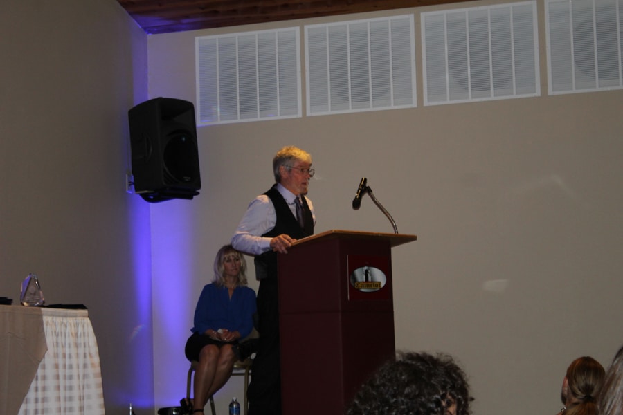 Dewayne Sexton speaking at podium at Moraine Park Student Awards banquet