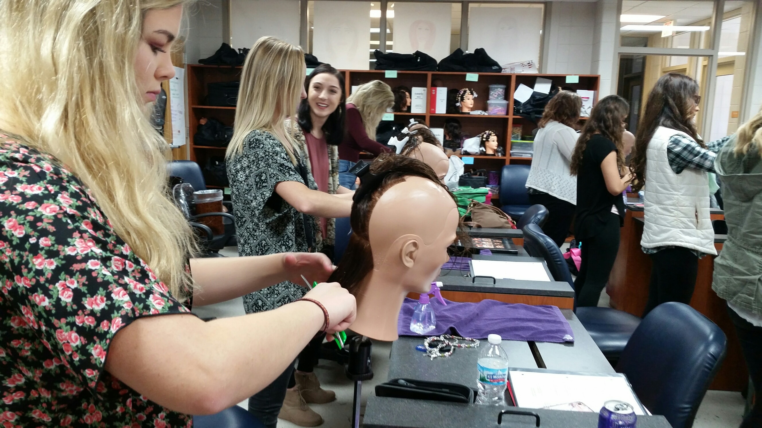 cosmetology students work on mannequins in moraine park classroom 
