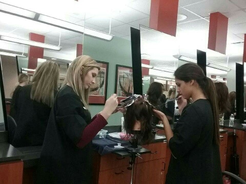 MPTC Cosmetology students applying color to hair