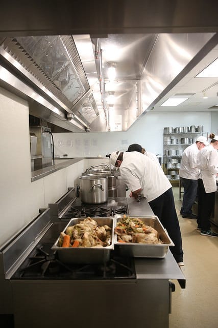 culinary students preparing gourmet dinner food