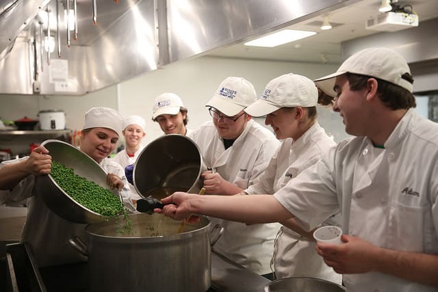 Culinary students making soup