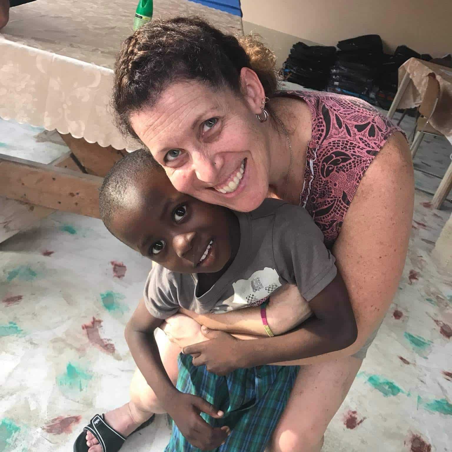Tammy with young man from Haiti