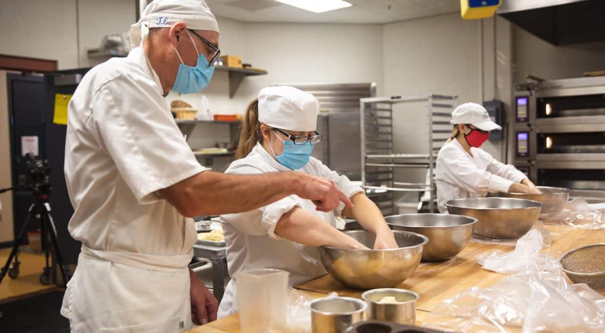 Students and instructor making bread