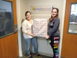 Staff member at Family Promise receive donations. 